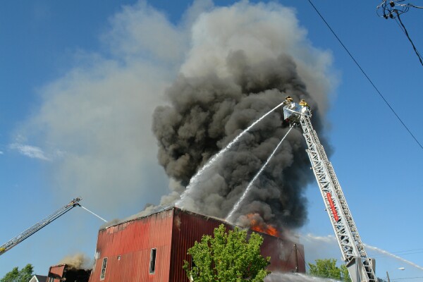 Fire breaks through roof